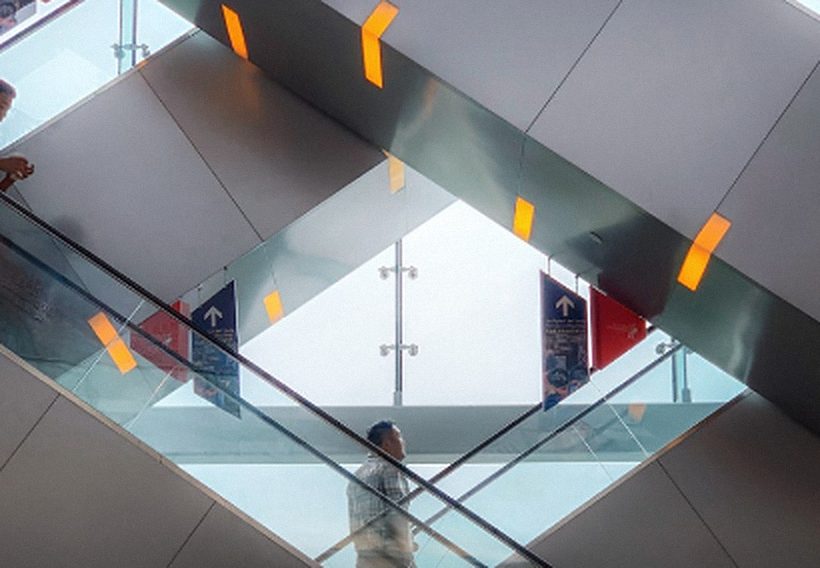 Escalators seen from below, crossing in diagonals